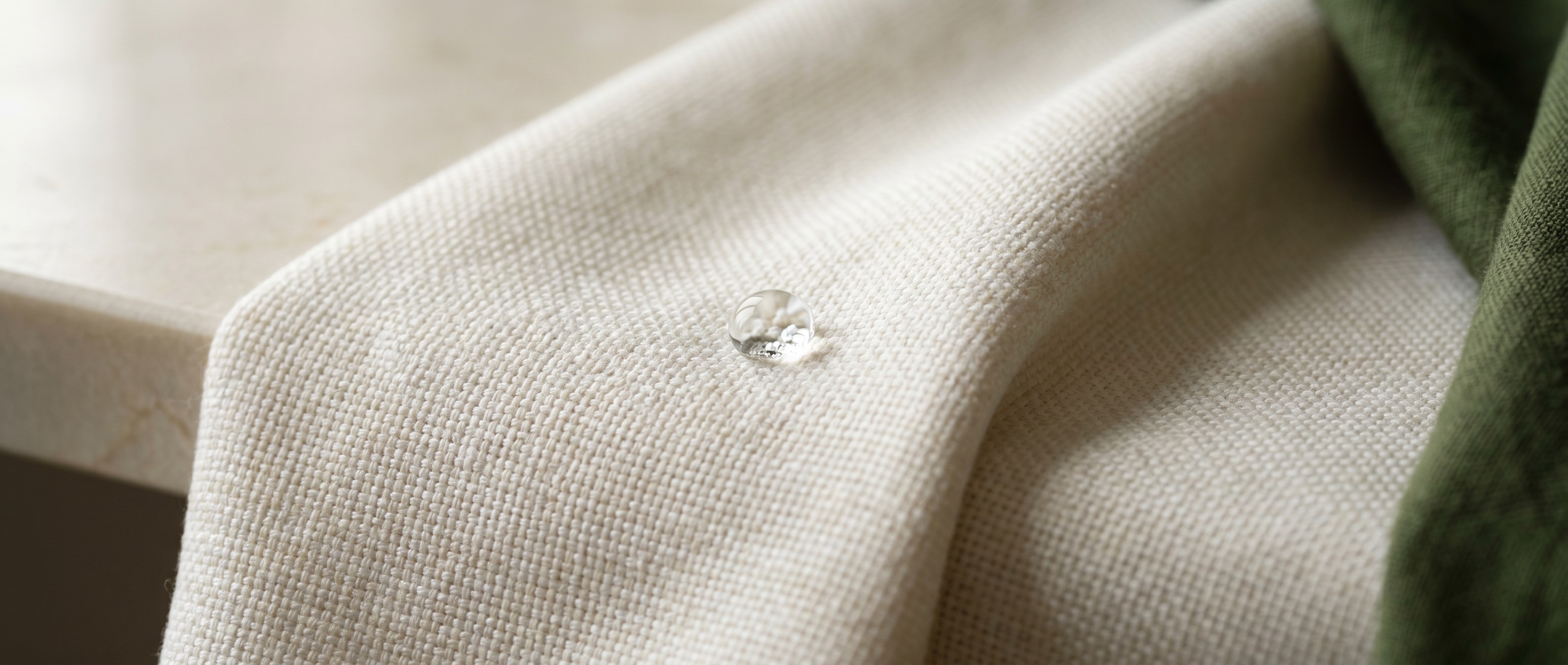 Water droplets beading on woven fabric